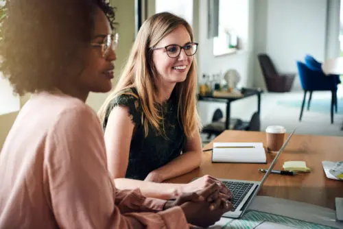 Two Female Professionals Working