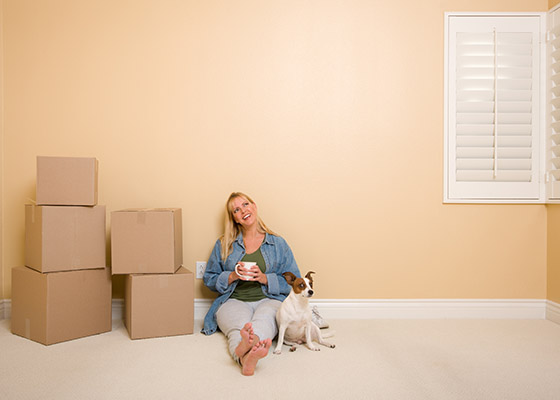 Woman Sitting on Floor With Boxes