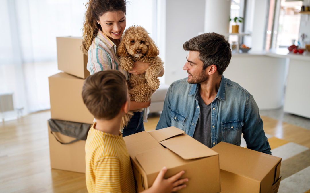 Young Family Unpacking Boxes