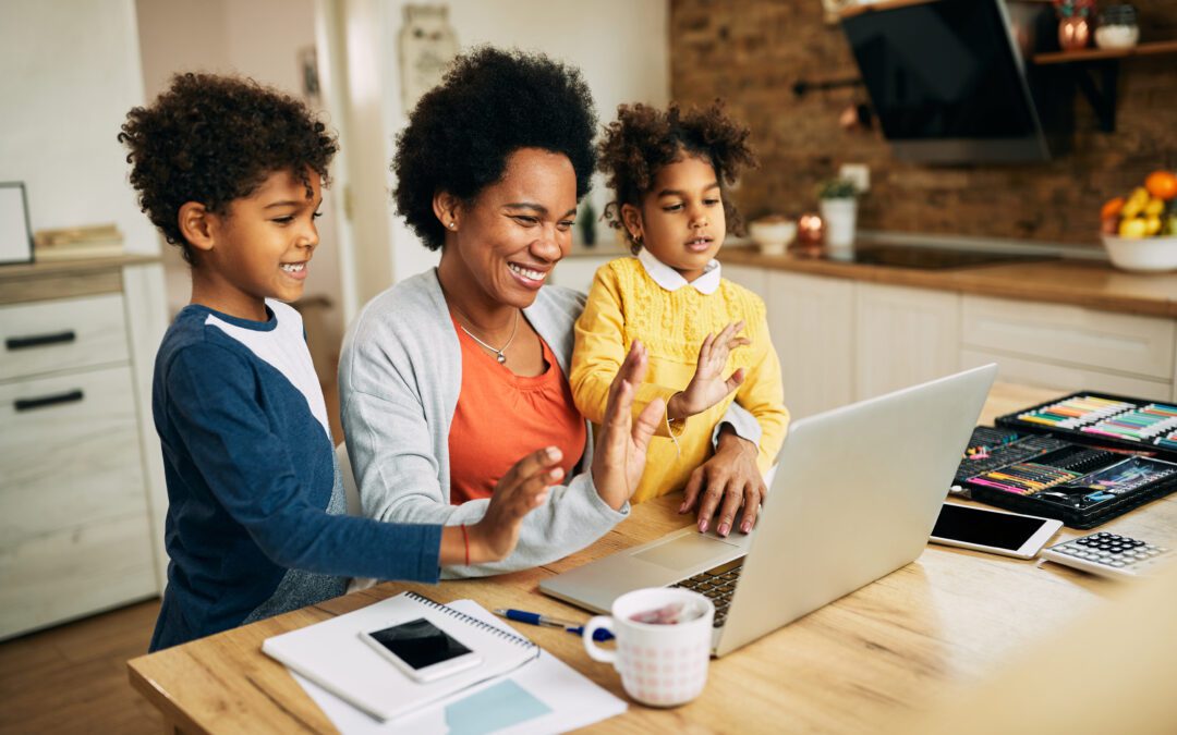 Family sitting together at kitchen table.