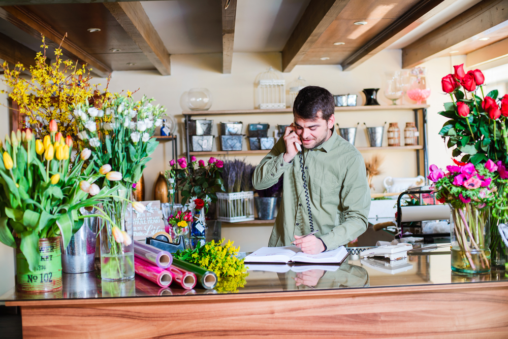 A man working in a flower shop.