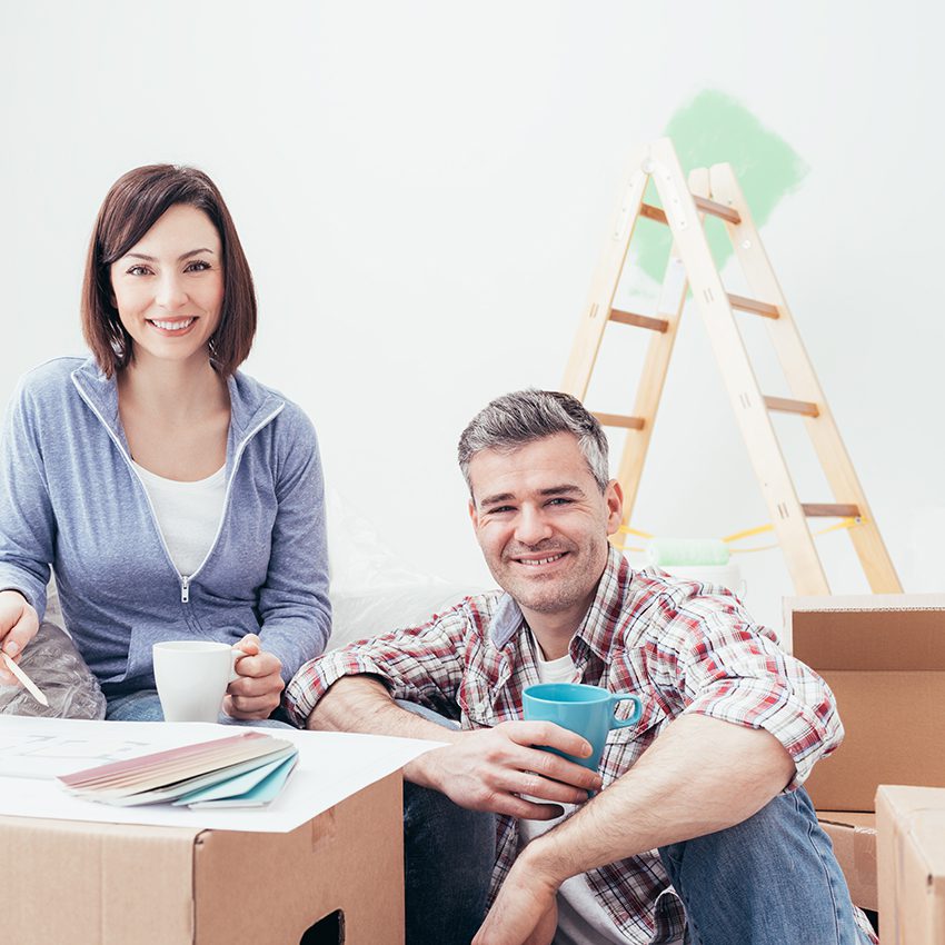 Man sitting on bench outside.